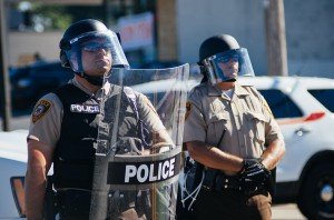 Police in riot gear at Ferguson, MO protests [photo credit: Jamelle Bouie, via Wikimedia Commons]