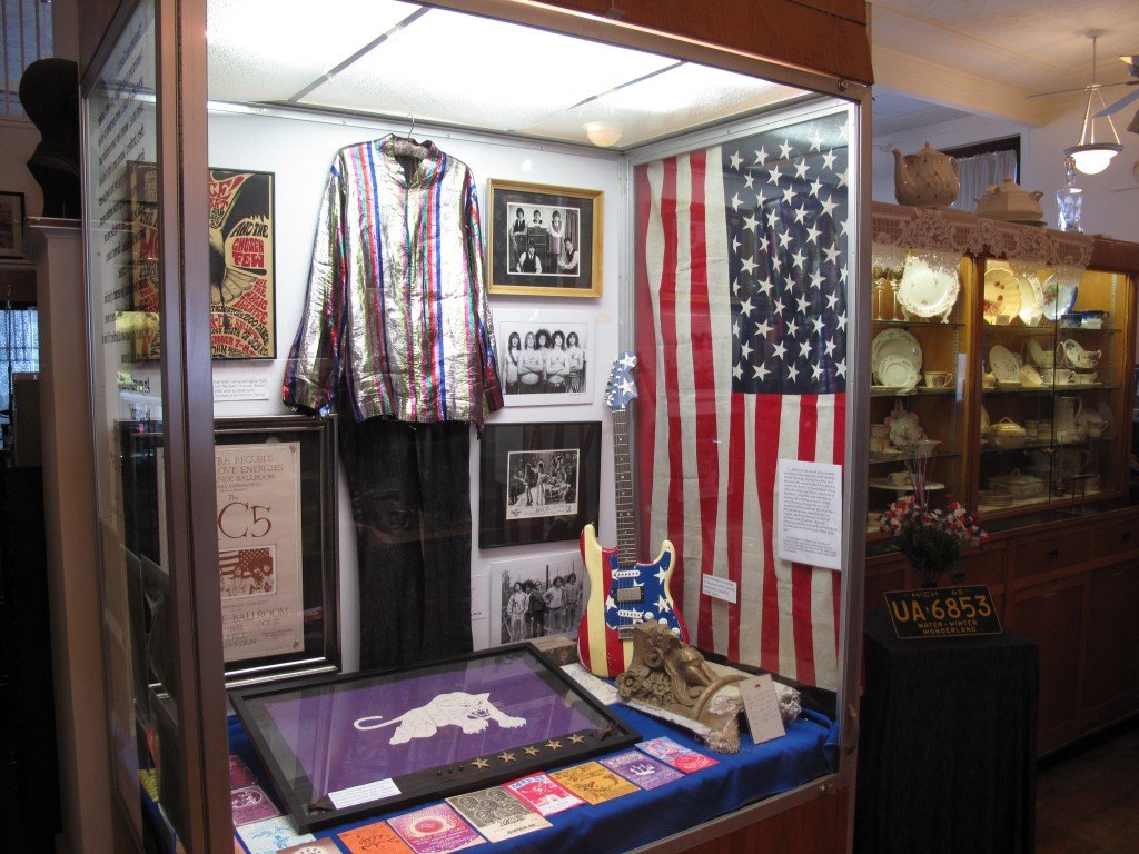 A scene from the museum, with Rob Tyner's outfit the dominant item in the display case. The china exhibit is to the right.