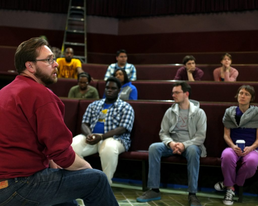 Flint Youth Theatre Executive Director Jeremy Winchester addresses the cast and crew before a rehearsal of "The Most [Blank] City in America," an original play about Flint Michigan.