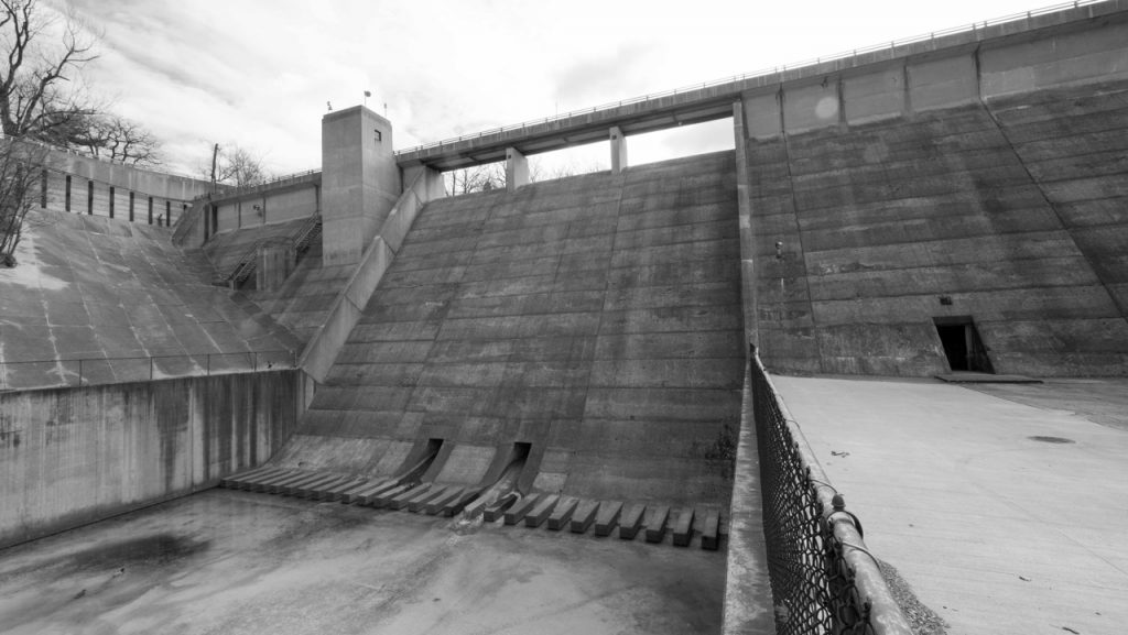 Situated in the center of Lakeview Cemetery, this concrete flood-control dam could probably best be described as architecture inspired by Joseph Stalin.